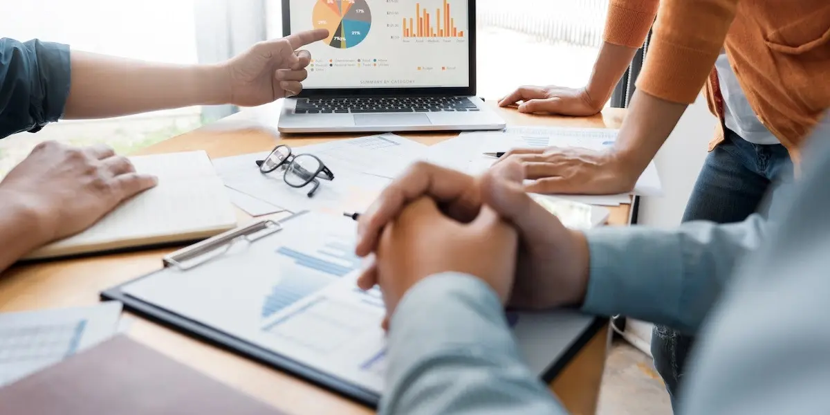 A business broker reviewing exit strategy options and transferability frameworks with a client.