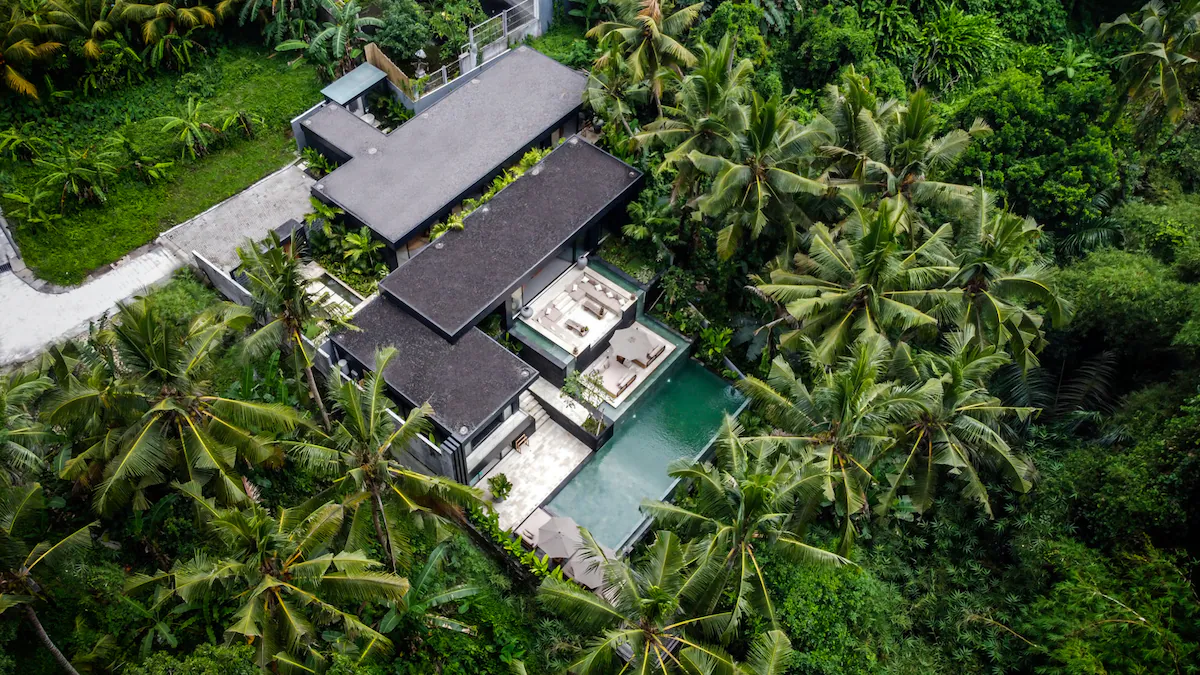 Luxury safari-style tented villa hidden within a dense jungle forest in Bali, Indonesia.