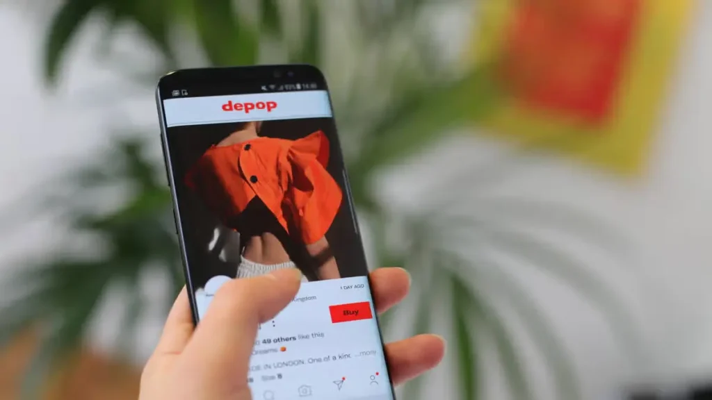 Depop-style secondhand fashion marketplace listings on a smartphone