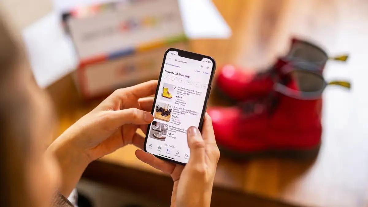 Buyer checking a secondhand fashion seller profile and listing
