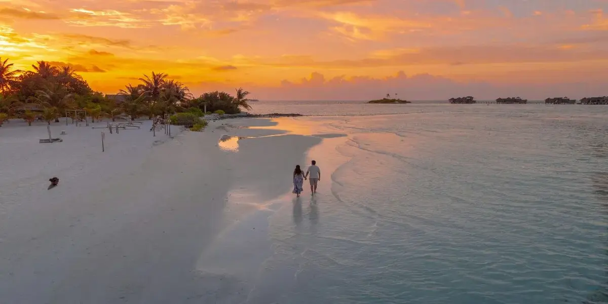 Traveler enjoying a sunset during a tropical vacation