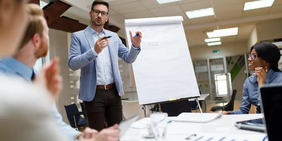 An entrepreneur giving a business presentation during a strategic corporate meeting