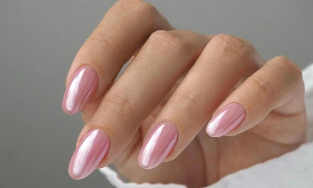 Reflective rose-pink metallic chrome powder layered over smooth almond-shaped tips-Cute Nail Ideas