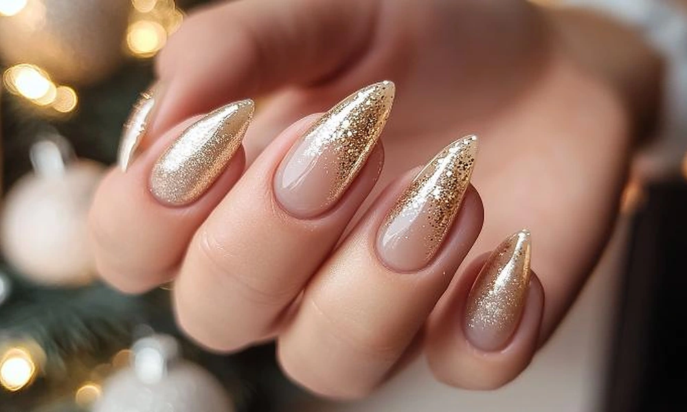 Sparkling champagne gold glitter gradient Christmas nails on almond-shaped extensions