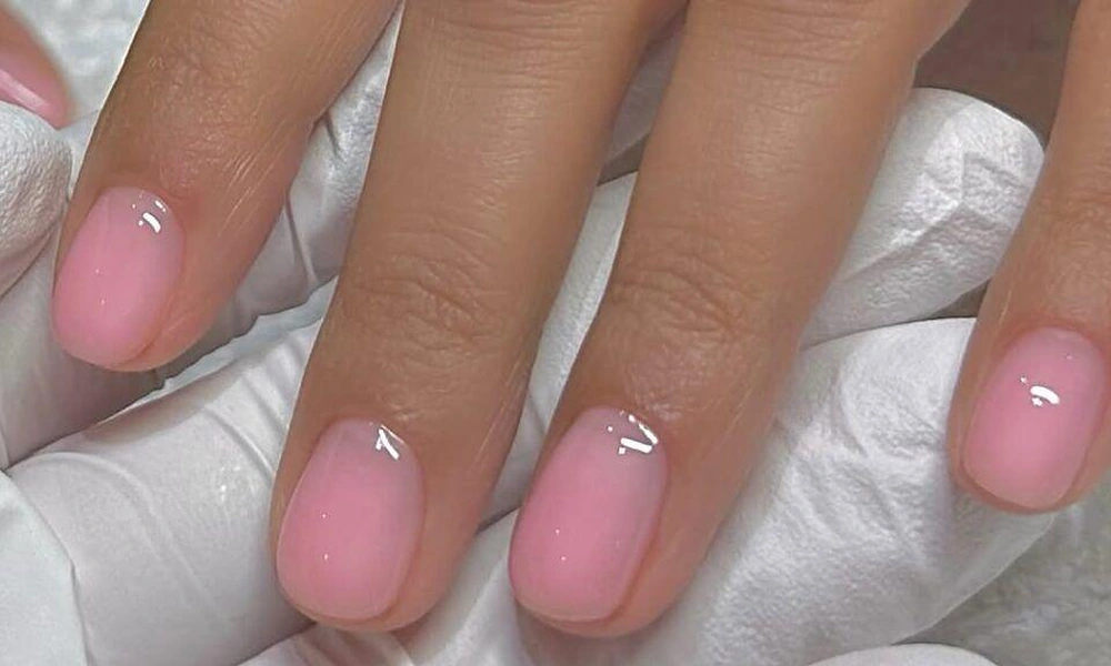 Short natural square tips finished with a sheer, candy-like glossy pink jelly coating-Cute Nail Ideas