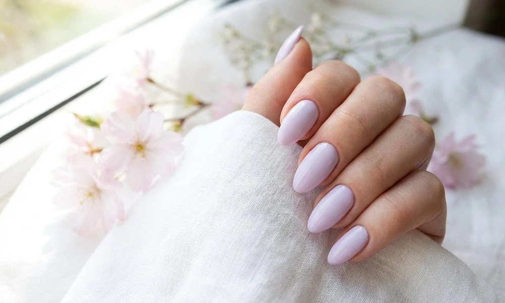 Smooth glossy lavender purple polish styled on graceful oval-shaped nails-Cute Nail Ideas