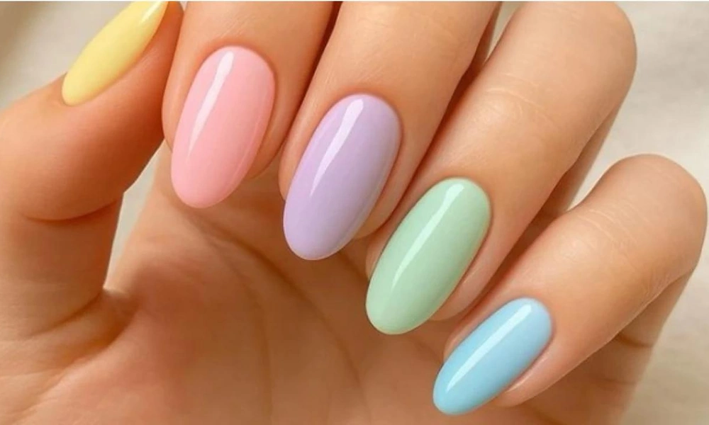 Multi-colored pastel manicure featuring yellow, pink, lavender, mint green, and light blue on almond tips-Cute Nail Ideas