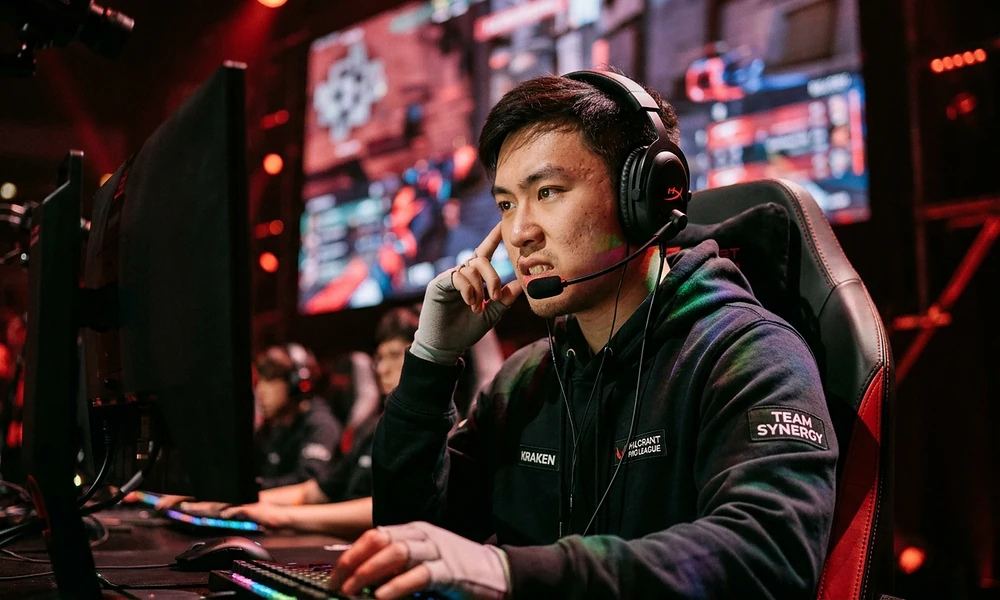 Professional esports player competing in a tournament with headphones, showcasing bold boy gamer nicknames