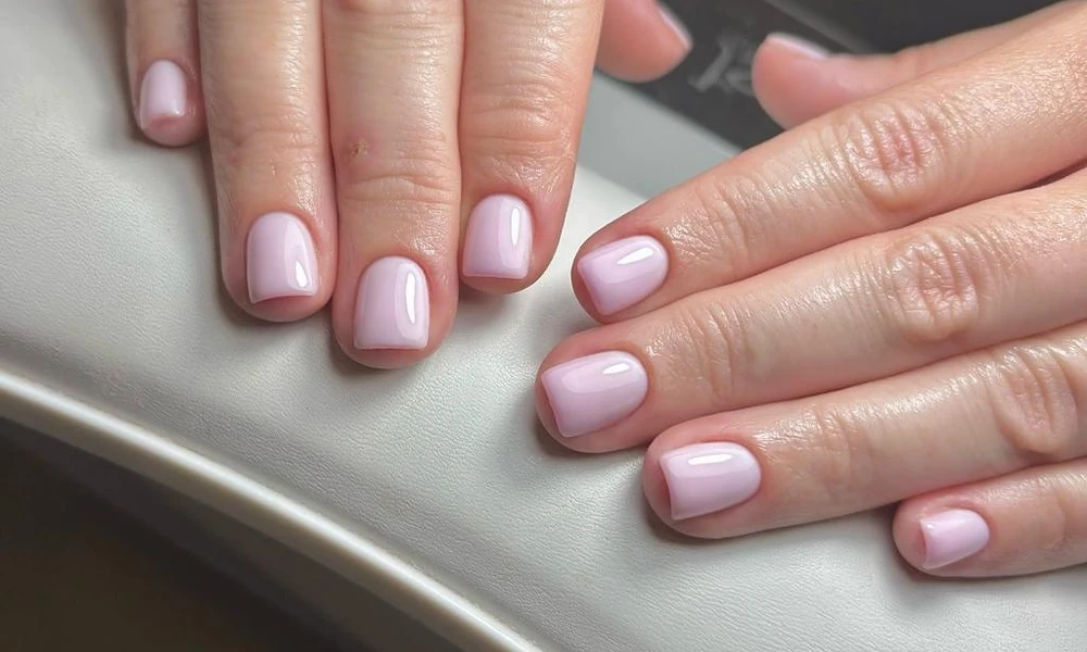 Short pale pink gel x nails with a neat square finish for practical daily wear
